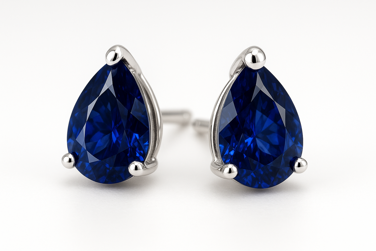 Pear shape blue sapphire studs on white gold settings